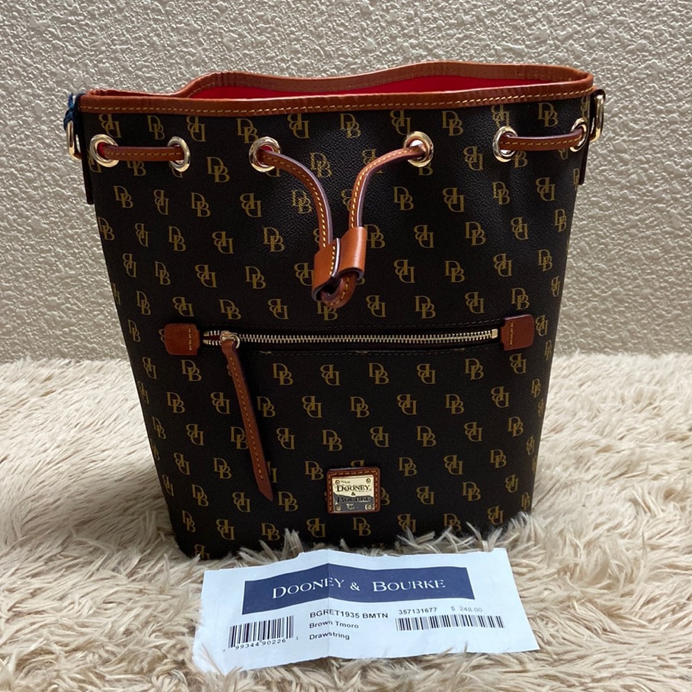 Auth Dooney & Bourke Coated Canvas with Brown Leather Trim Drawstring